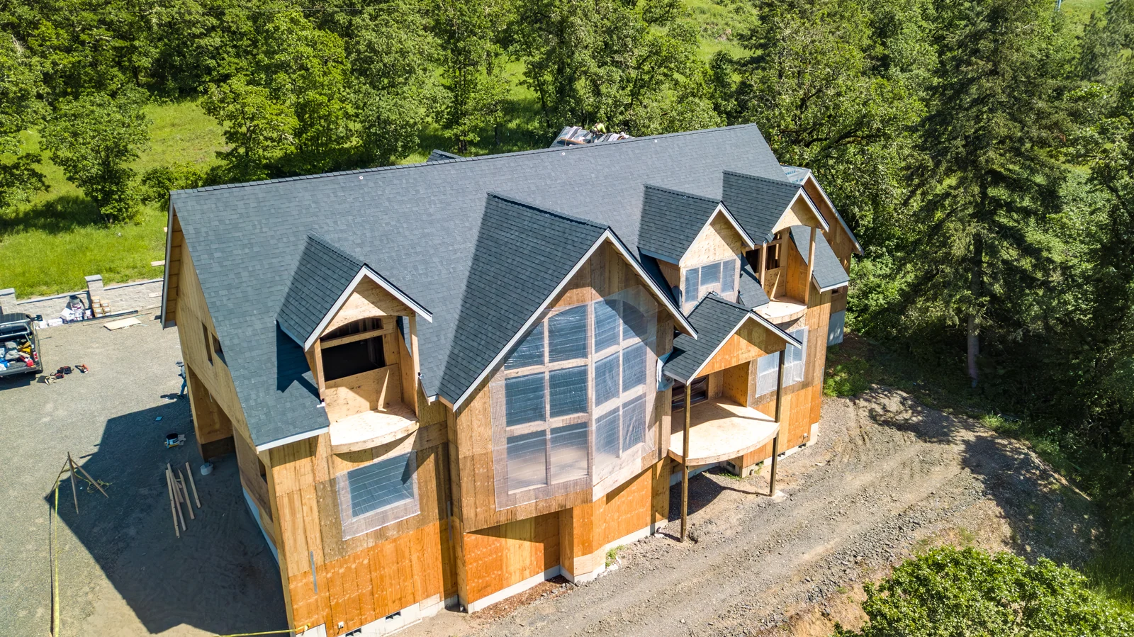 Actual home under construction with installed Onyx Black Owens Corning Duration shingles
